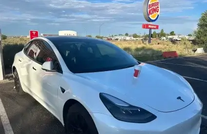 Tesla charging at a supercharger in Hollbrock, AZ