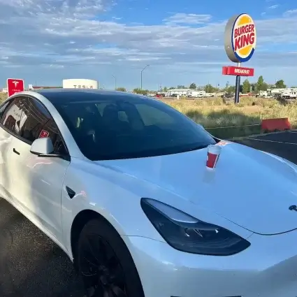 Tesla charging at a supercharger in Hollbrock, AZ