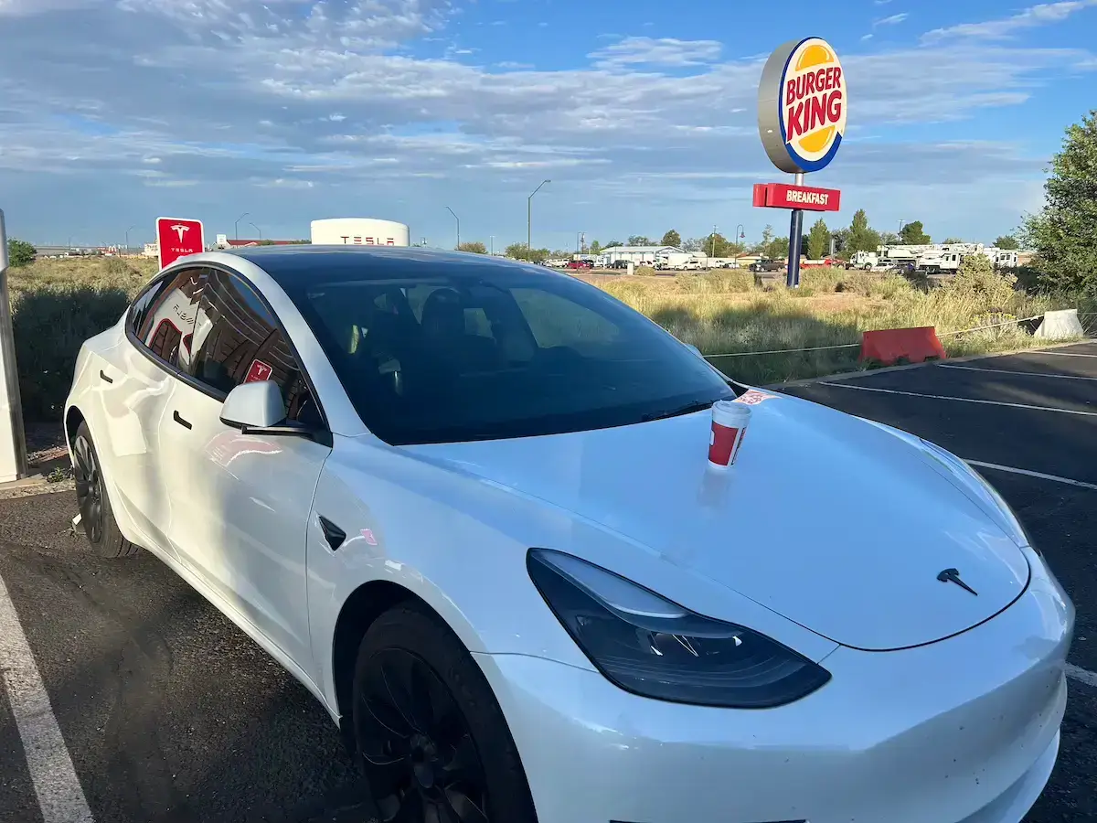 Tesla charging at a supercharger in Hollbrock, AZ